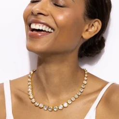 Catherine Round Rivière in White
